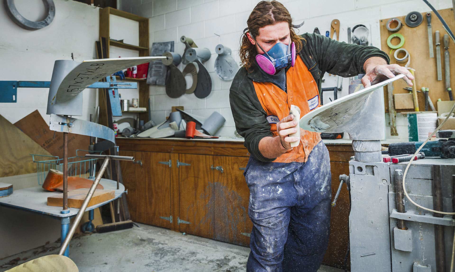 Shaping a propeller blade blank to the required pitch